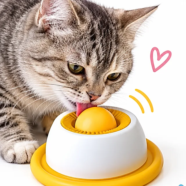 Chat qui lèche la gamelle rotative Naïa Orbe jaune